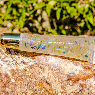 Watercolor crystals handmade multicolored lip gloss with a passion fruit scent.